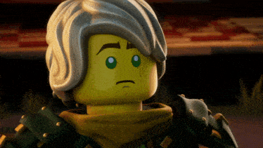 a close up of a lego character with a sad face