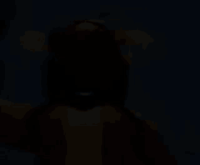a blurry picture of a person 's face in the dark