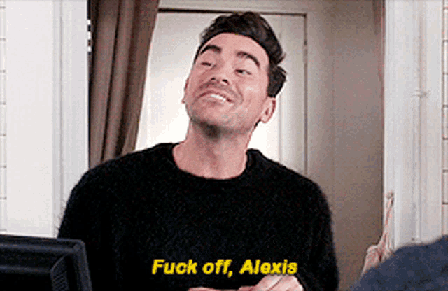 a man wearing a black sweater says fuck off alexis