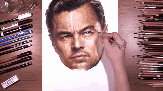a person drawing a man 's face with a prismacolor eraser