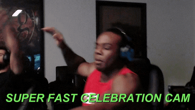 a man wearing headphones is dancing with the words super fast celebration cam behind him