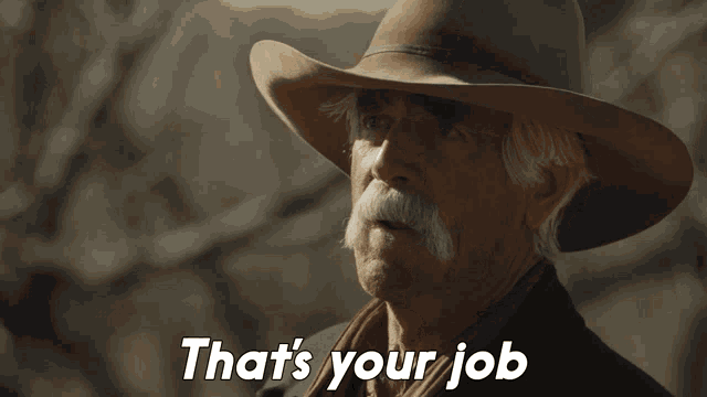 a man with a cowboy hat and mustache says " that 's your job "