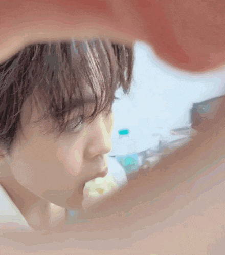 a close up of a person 's face with their mouth open