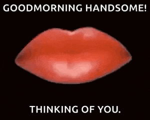 a red donut with a hole in the middle is on a black background with the words good morning handsome thinking of you .