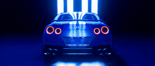 a blue sports car with a california license plate