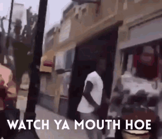 a man is walking down a street with the words watch ya mouth hoe written on the bottom
