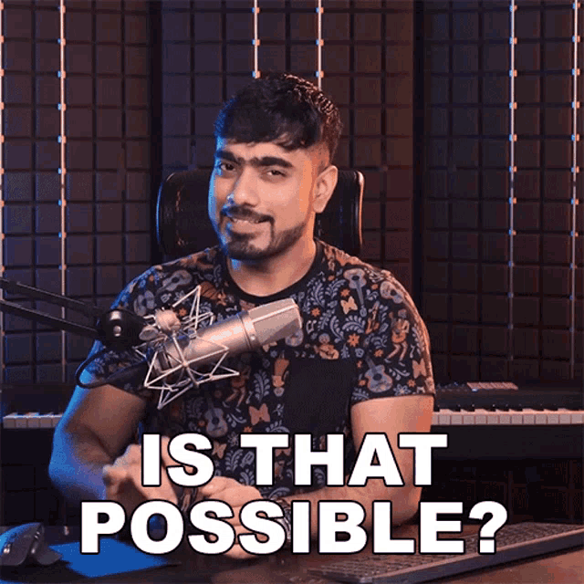 a man sitting in front of a microphone with the words " is that possible " written below him