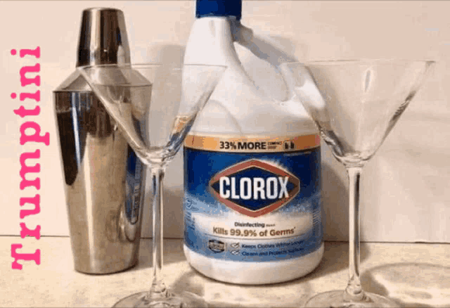 a bottle of clorox next to a shaker and two glasses