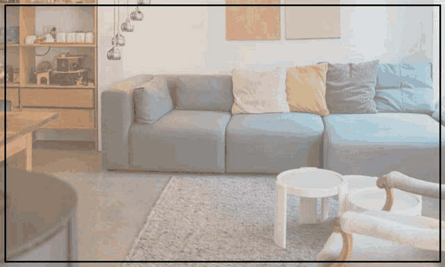 a living room with a couch and two tables and the words " best air purifier " above it