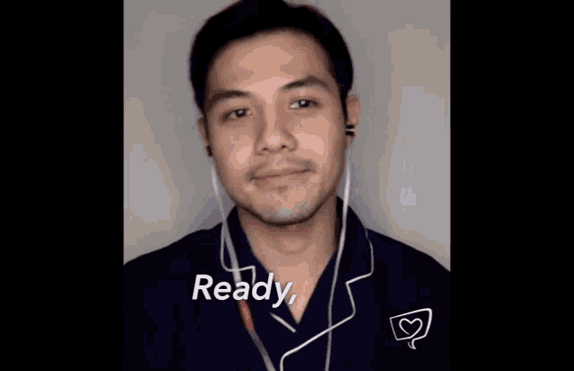 a man wearing ear buds says " ready girl "