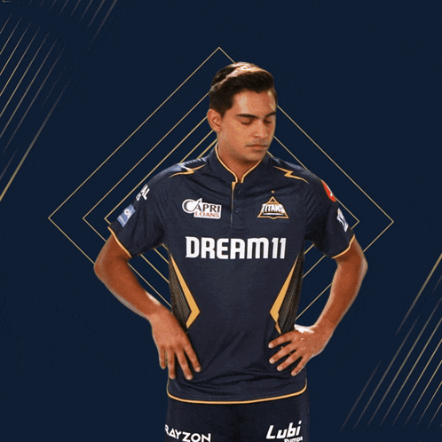 a man wearing a blue shirt that says dream11