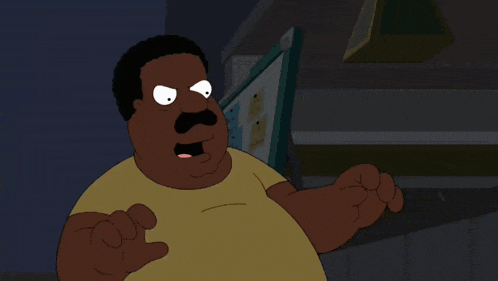 a cartoon character with a mustache and a yellow shirt stands in front of a computer monitor