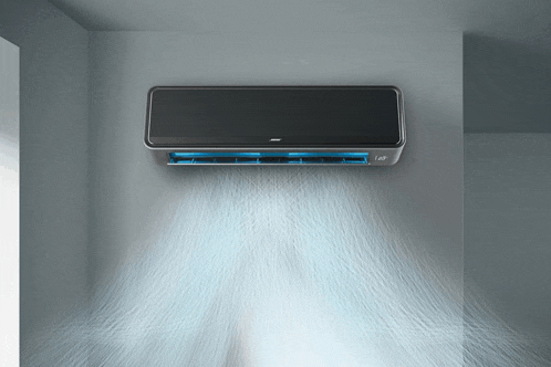 a black air conditioner is hanging on a wall and blowing cool air