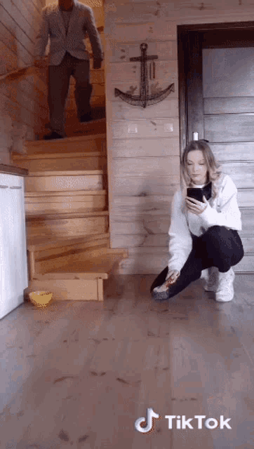 a tiktok video of a man walking down stairs