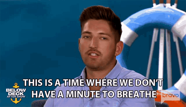 a man says " this is a time where we don 't have a minute to breathe " in front of a life preserver