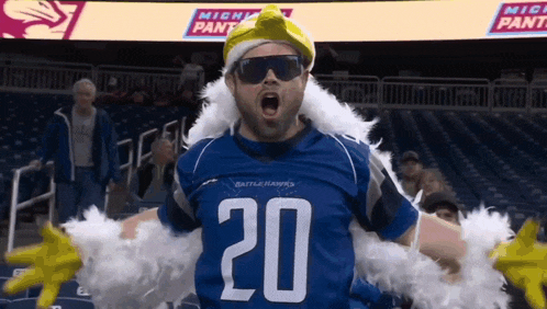 a man wearing a blue jersey with the number 20