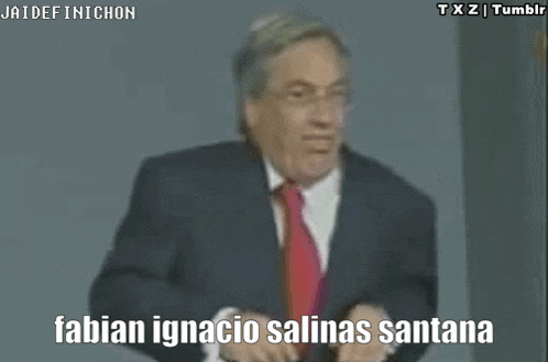 a man in a suit and tie is making a funny face and saying .