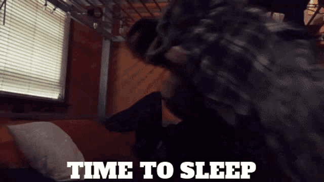a person laying on a bed with the words time to sleep on the bottom