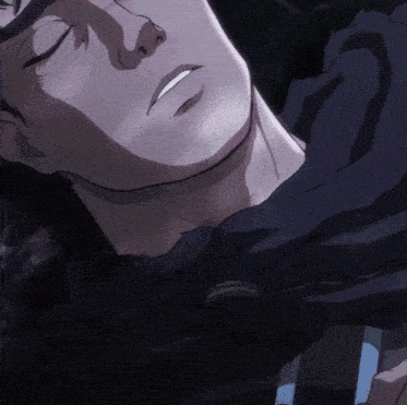 a close up of a man 's face with his eyes closed and a smile on his face