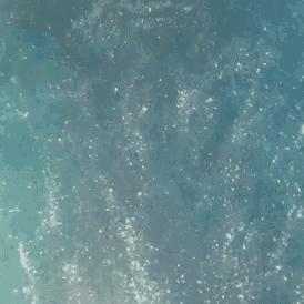 a close up of a blue surface with bubbles coming out of it