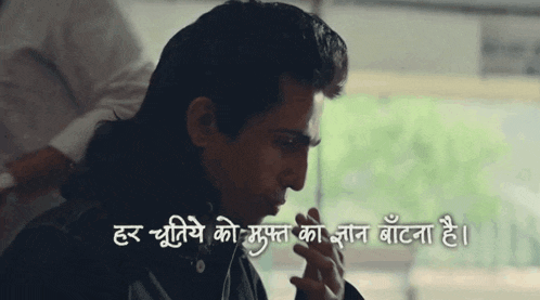 a man smoking a cigarette with a foreign language written below him