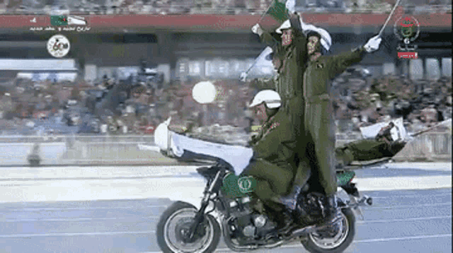 a group of soldiers are riding a motorcycle in front of a crowd with the number 6 on the screen