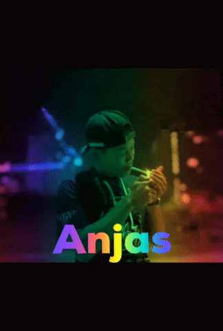 a man playing a trumpet with the name anjas on the bottom right