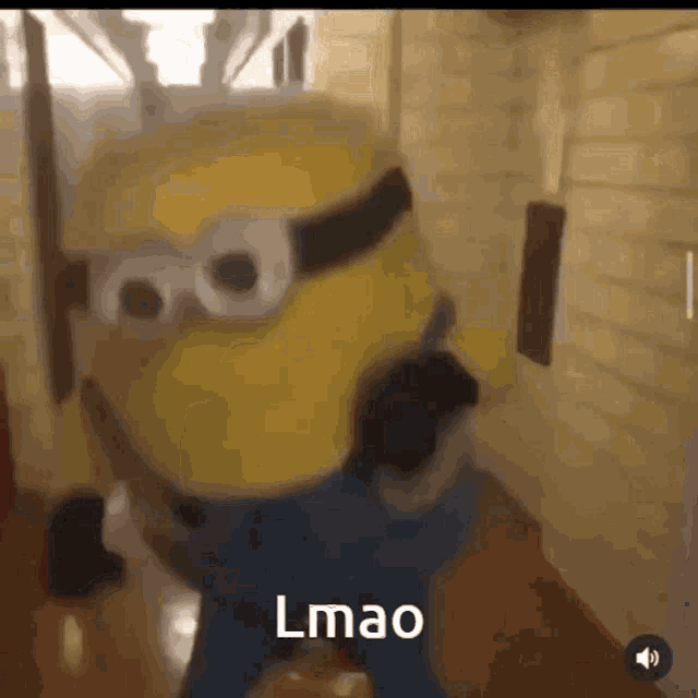 a blurry picture of a minion with the words lmao written on it