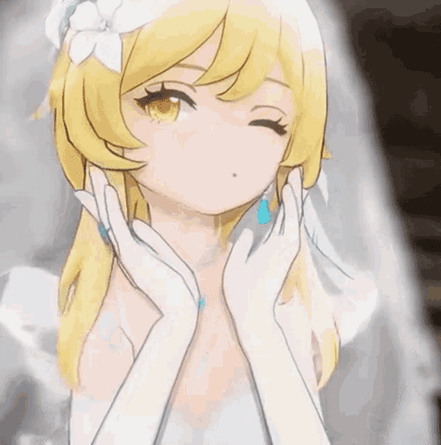 the girl is wearing a wedding dress and gloves and is making a funny face .