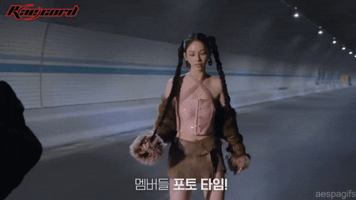 a woman in a pink top and brown jacket is standing in a tunnel with the word ranger on the bottom