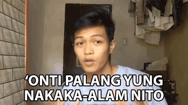 a young man says " onti palang yung nakaka-alam nito " in front of a brick wall