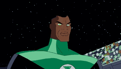 a green lantern symbol is glowing in the dark on a blue background .