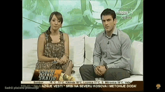 a man and a woman are sitting on a couch on a tv show
