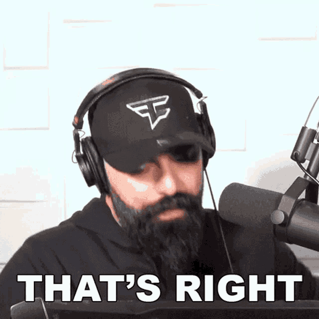 a man with a beard wearing headphones says " that 's right "