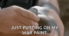 a person is putting on a watch on their wrist .