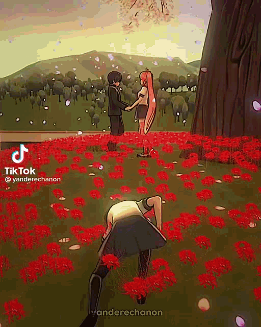 a man and a woman are standing in a field of red flowers