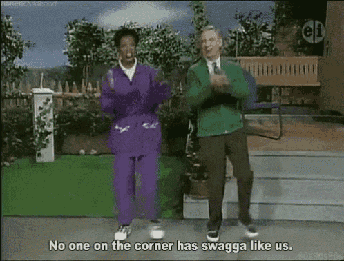 a man and a woman are dancing in front of a bench and the man says no one on the corner has swagga like us