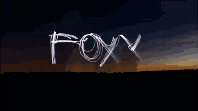 the word wolfie is written in white on a dark sky