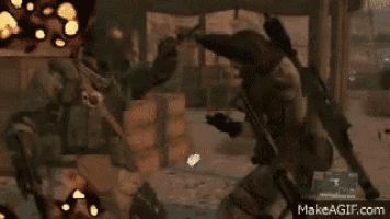a soldier is holding a gun in a video game while another soldier is standing next to him .