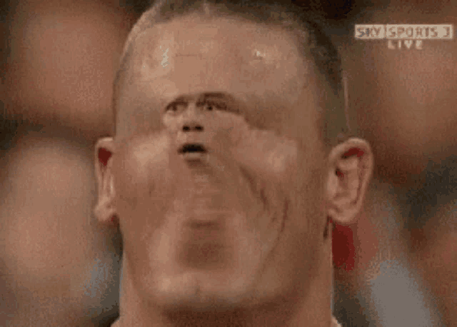 a close up of a man 's face with the words sky sports live behind him