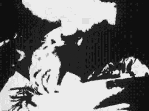 a black and white painting of a man and woman kissing