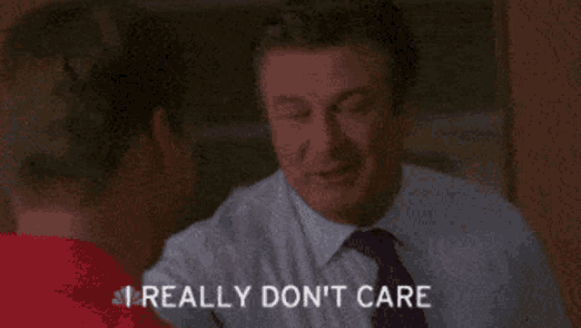 a man in a suit and tie is saying i really don 't care
