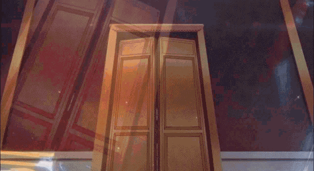 a gold door is open in a room with a red wallpaper