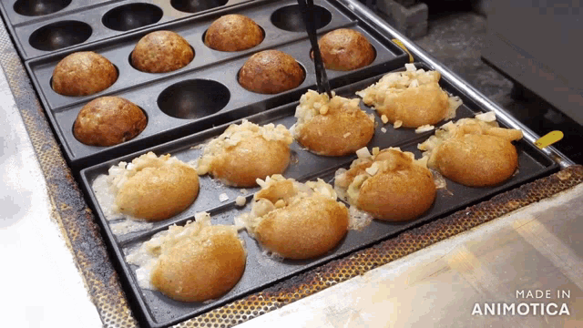 a bunch of food being cooked in a pan with the words made in animotica