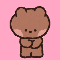 a brown teddy bear with red hearts around its neck
