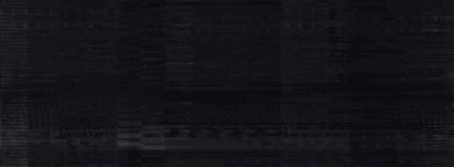 a blurred image of a person 's face with a black background and a white and yellow light coming out of it .