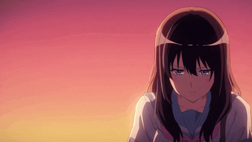 a girl with long black hair and blue eyes is looking down
