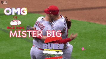 two baseball players are standing on a field and one of them has the number 28 on his shirt