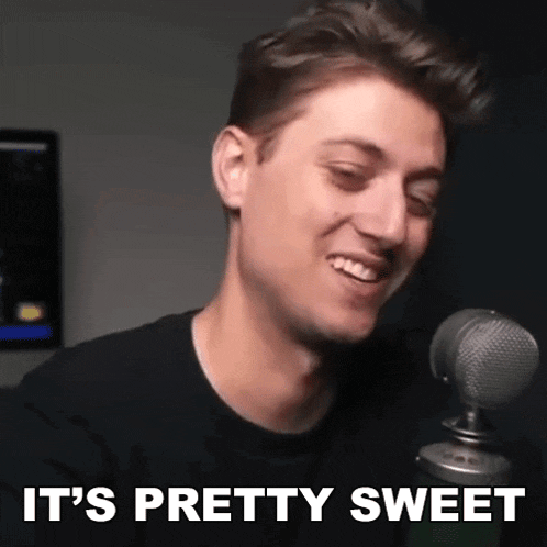 a man is smiling in front of a microphone and the words `` it 's pretty sweet '' are written below him .