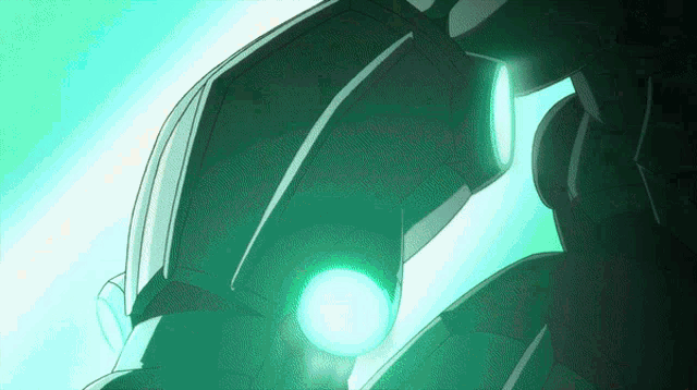 a close up of a green object with a light coming out of it 's eye